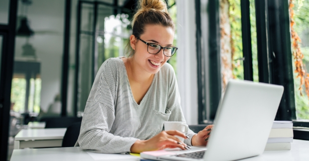 Woman working on a blog using a laptop