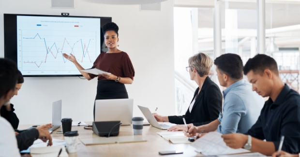 Colleague reviewing sales analytics with company