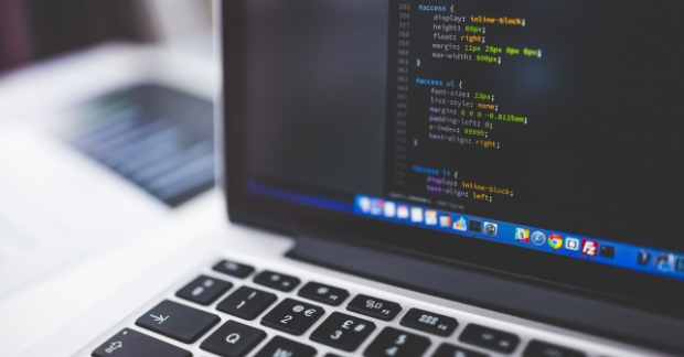Website CSS shown on laptop screen