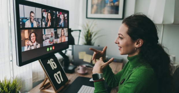 Remote worker speaking on virtual meeting with multiple attendees