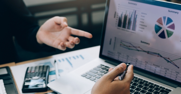 People reviewing marketing budget numbers