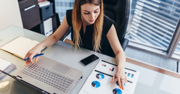 Woman reviewing data at her desk