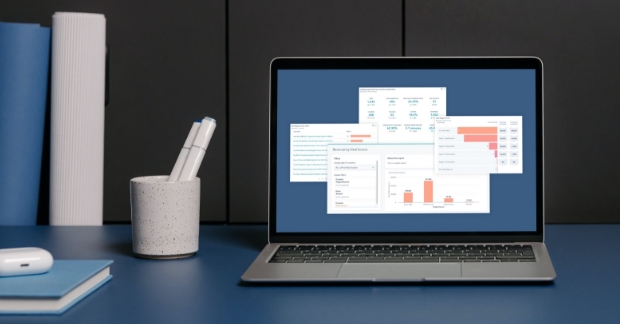 Various HubSpot reports shown on laptop